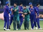 Mohammad Rizwan and Babar Azam shake hands with Indian players