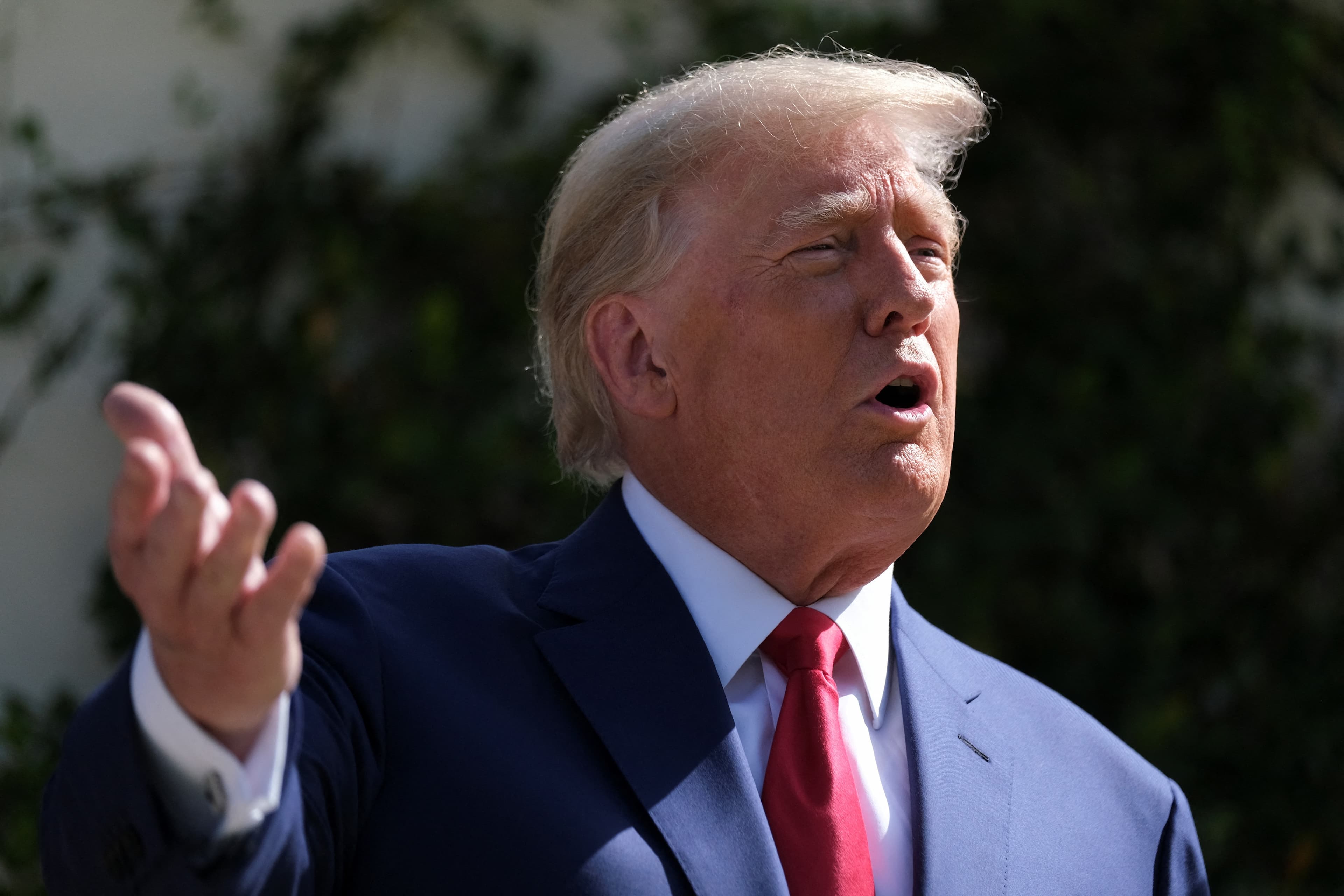 US midterm elections: Former US President Donald Trump speaks outside a polling station. (Reuters)