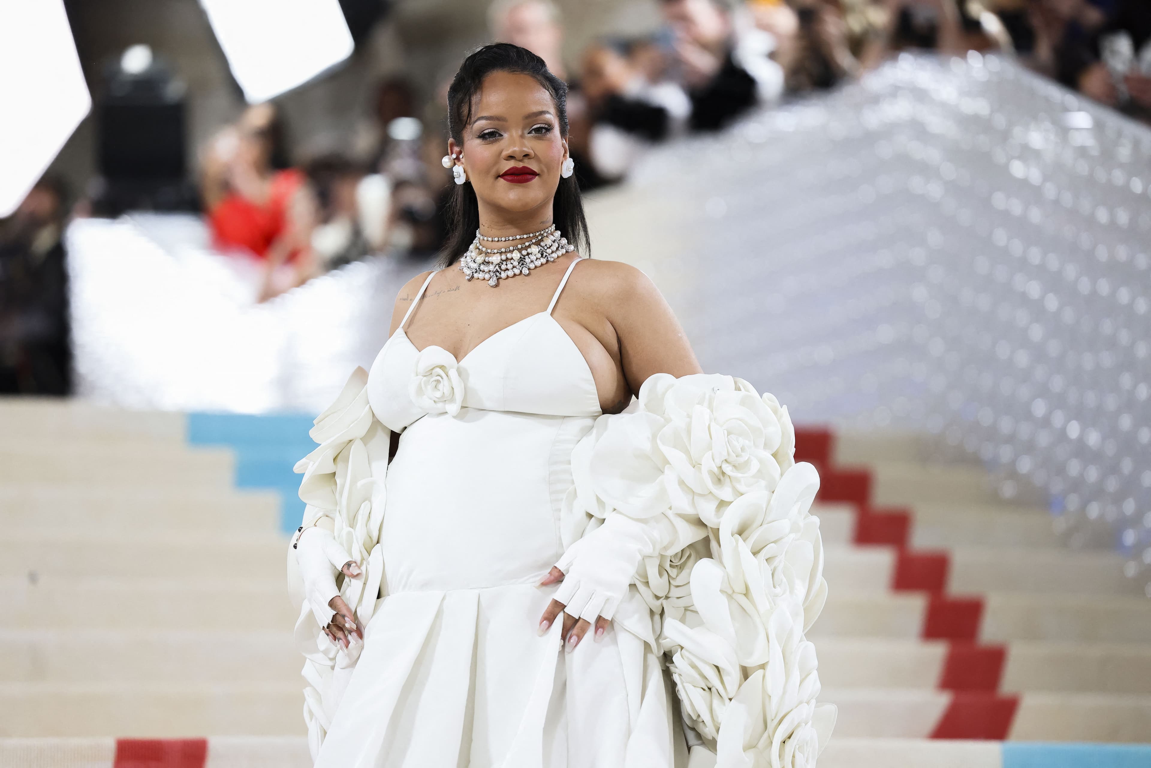 Rihanna removed her hoodie to show off her entire gown at the Met Gala. (REUTERS)