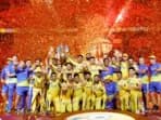 CSK players pose with the trophy after winning the IPL 2023 title