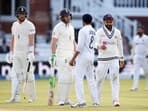 India's Virat Kohli and Ravindra Jadeja as England's Jos Buttler and Ollie Robinson look on.