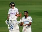 India's Ravichandran Ashwin celebrates with Ravindra Jadeja after taking the wicket of England's Mark Wood