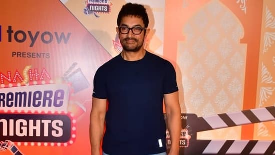It's been 25 years since Sarfarosh was released. To celebrate this milestone, Aamir Khan and other celebrities attended a special screening of the film on Friday night. In the 1999 film, Aamir essayed the role of ACP Ajay Singh Rathod. Aamir Khan arrived in his casual attire. He wore a dark blue T-shirt, denim jeans and his signature glasses. Aamir also posed for the paparazzi.