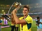Australia's Pat Cummins celebrates with the ODI World Cup Trophy