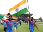 India's Mohammed Siraj and Jasprit Bumrah celebrate after winning the T20 World Cup.