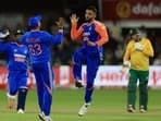 India's Varun Chakaravarthy celebrates after taking the wicket of South Africa's Heinrich Klaasen.