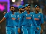 India's Mohammed Shami celebrates with Virat Kohli, Shreyas Iyer and Suryakumar Yadav after taking the wicket of Sri Lanka's Charith Asalanka, caught by Ravindra Jadeja
