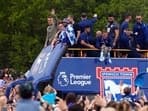 Ipswich Town manager Kieran McKenna and players wave to the fans from the parade bus as they celebrate promotion to Premier League.