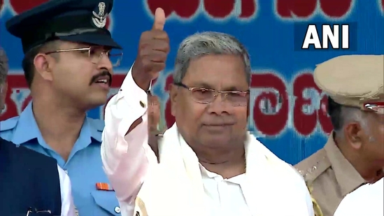 Congress leader Siddaramaiah flashes a thumbs up sign after taking oath as Chief Minister, at Bengaluru's Kanteerava Stadium on Saturday, May 20, 2023. (ANI)