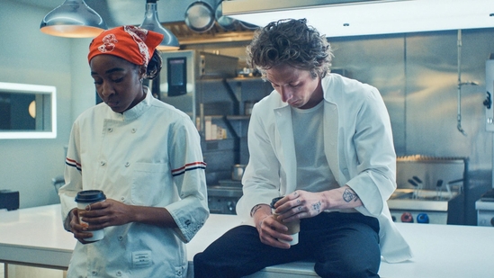 Ayo Edebiri and Jeremy Allen White in a still from The Bear Season 3.