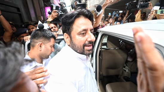 Amanatullah Khan being taken away by ED officials. (Sanchit Khanna)