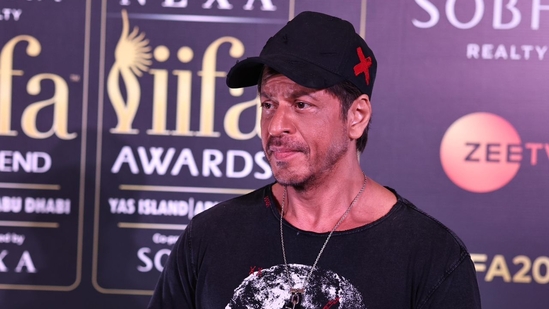 Shah Rukh Khan covered his new look with a cap.