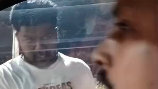 In a viral video, a car was stopped in the middle of a Bengaluru road by the miscreants and they demanded the person inside to get out of the car. When he refused to come out, stones were hurled at the windows of the car. (X/Anoop)